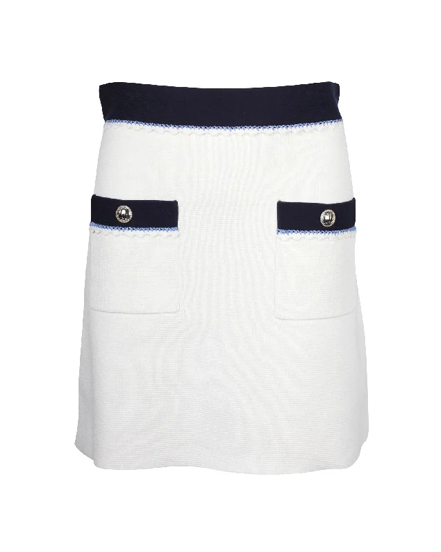 Elegant Interpretation Design Maje Oliana Button-Embellished Two-Tone  Mini Skirt in Black and White Cotton